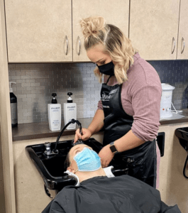 stylist doing conditioning treatment